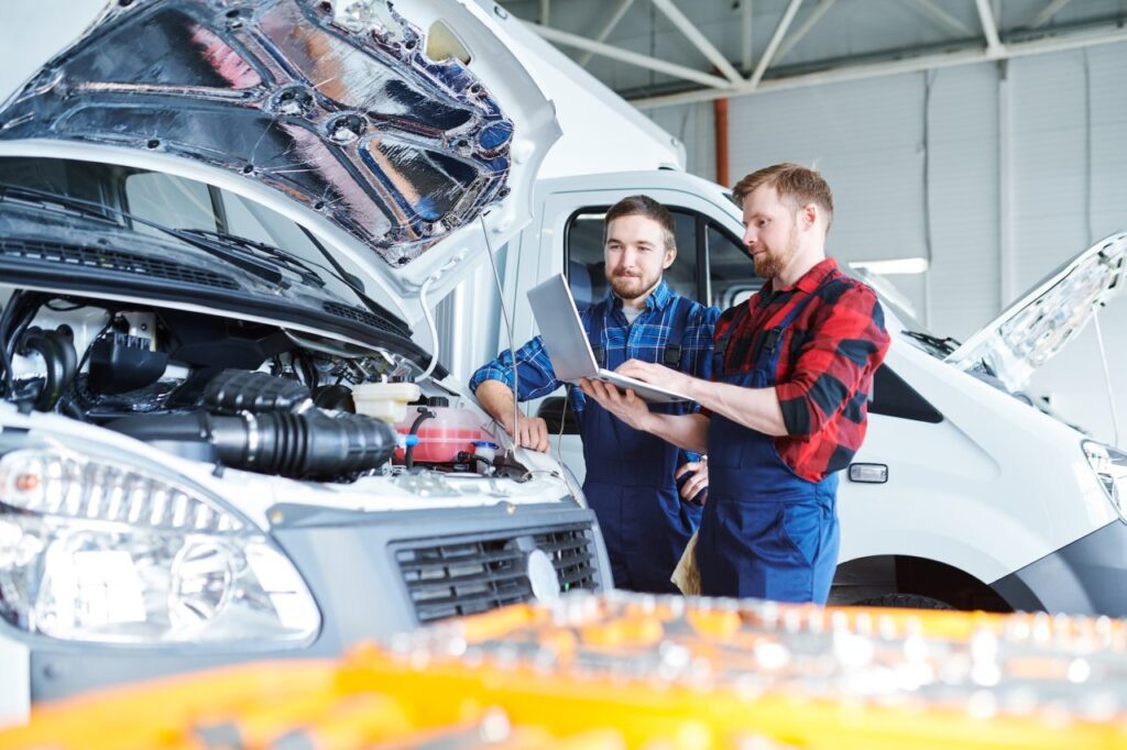 A professional consulting with a client about brake repair.
