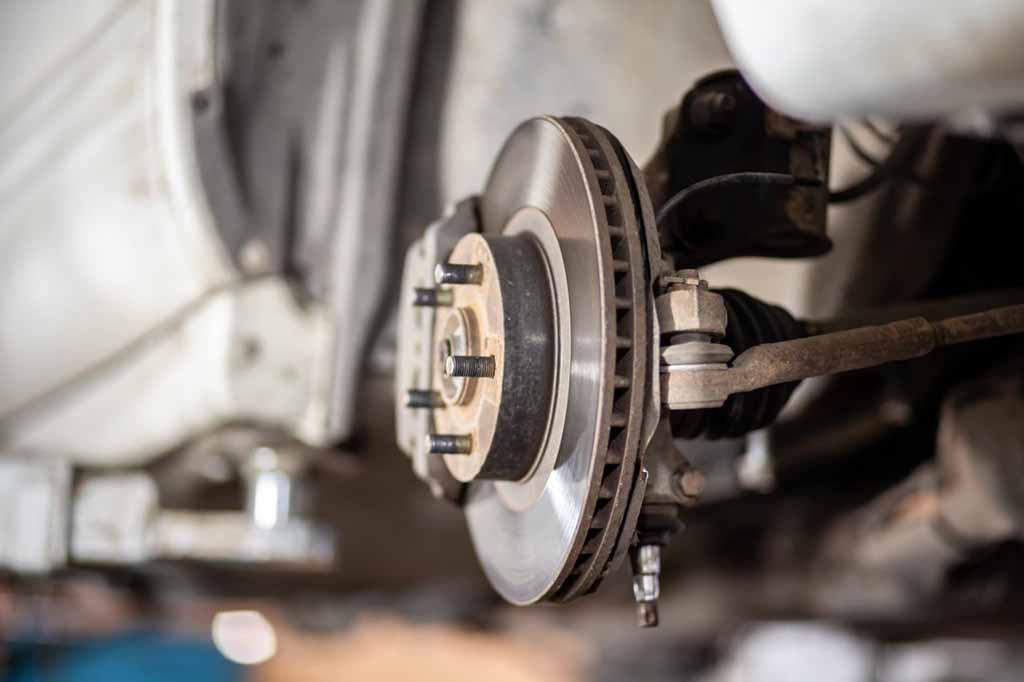 Cars needing brake replacement in a shop in Las Vegas, NV.